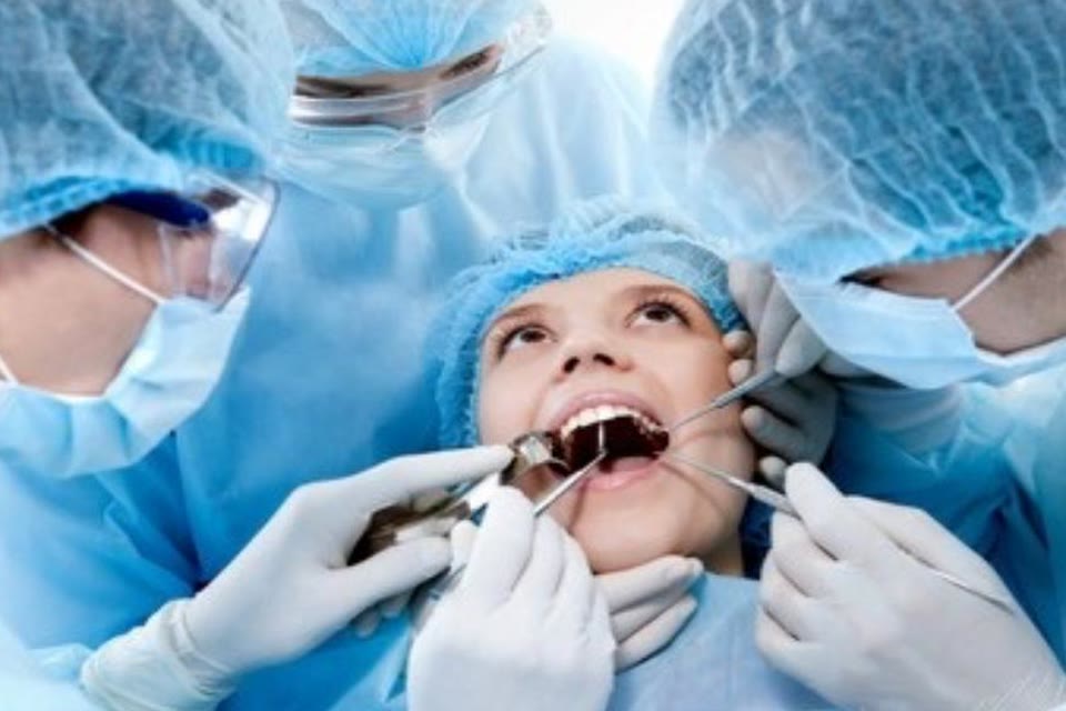 Dental surgical team treating a patient